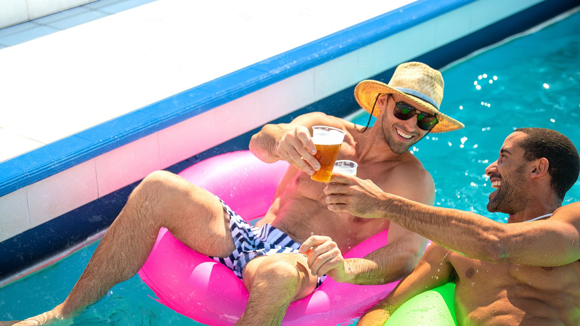 A Couple Of Men In Swimsuits On A Boat Drinking Beer