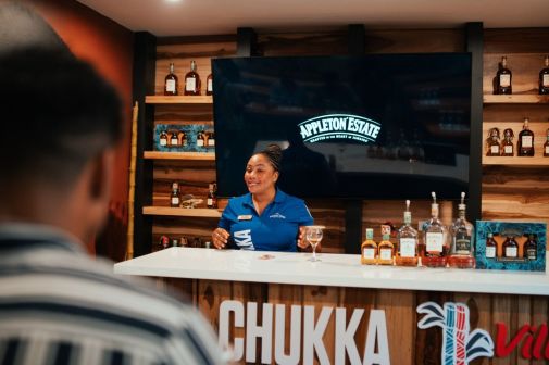 A Person Sitting At A Bar