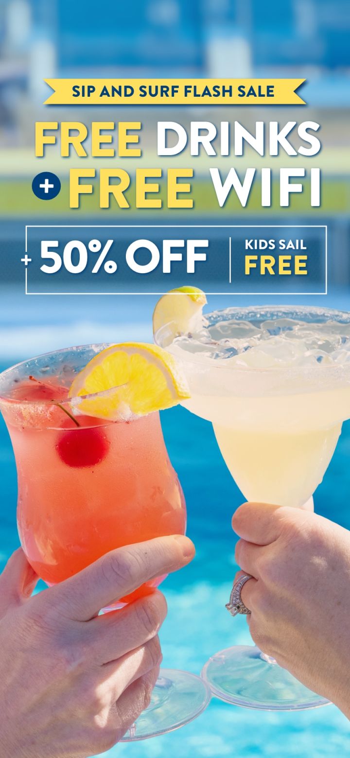 A Pair Of Hands Holding Glasses Of Liquid With Lemons And A Lemon Slice On Top